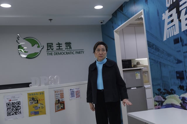 Emily Lau, former chairperson of the Democratic Party, walks through the Democratic Party's office in Prince Edward in Hong Kong on April 2, 2025. (AP Photo/May James)