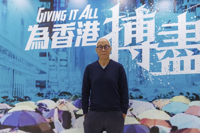 Yeung Sum, the founding member of the Democratic Party, poses for a photo at the Democratic Party's office in Prince Edward in Hong Kong on April 2, 2025. (AP Photo/May James)