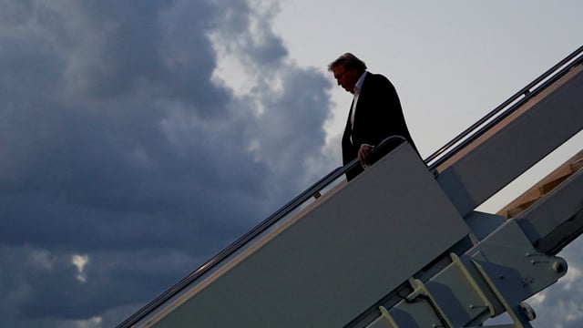 U.S. President Donald Trump disembarks Air Force One at Palm Beach International Airport, West Palm Beach, Florida, U.S., April 11, 2025. REUTERS/Nathan Howard