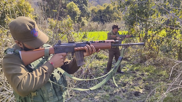 Security personnel during a search operation near LoC forest area, in Akhnoor sector in Jammu.
