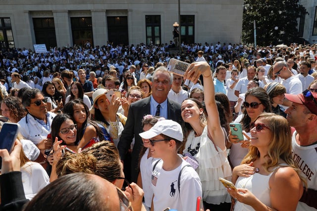 Robert F. Kennedy Jr. is surrounded by supporters as he departs New York State Supreme Court after a hearing challenging the constitutionality of the state legislature's repeal of the religious exemption to vaccination in Albany, New York, in August 2019.