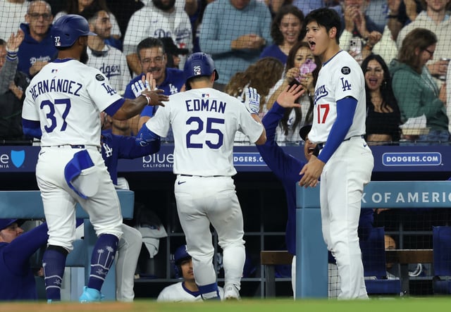 Apr 11, 2025; Los Angeles, California, USA; Los Angeles Dodgers outfielder Tommy Edman (25) celebrates with designated hitter Shohei Ohtani (17) and outfielder Teoscar Hernandez (37) after hitting a three-run home run during the sixth inning against the Chicago Cubs at Dodger Stadium. Mandatory Credit: Kiyoshi Mio-Imagn Images