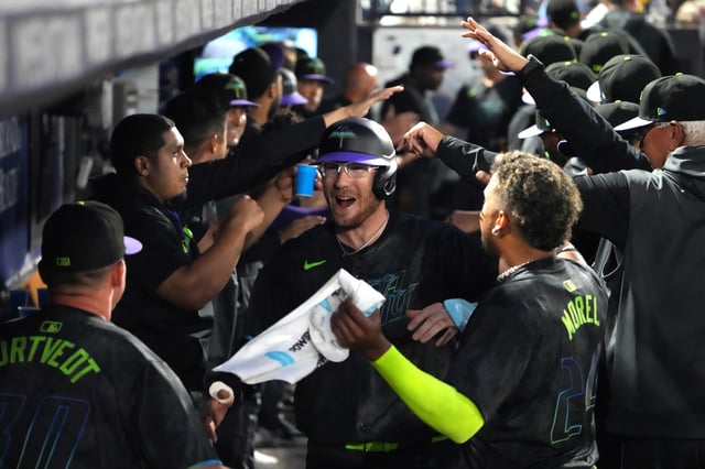 Apr 11, 2025; Tampa, Florida, USA; Tampa Bay Rays catcher Danny Jansen (19) is congratulated in the dugout after hitting a home run against the Atlanta Braves during the fourth inning at George M. Steinbrenner Field. Mandatory Credit: Dave Nelson-Imagn Images