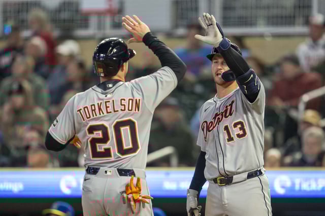 Apr 11, 2025; Minneapolis, Minnesota, USA; Detroit Tigers first baseman Spencer Torkelson (20) celebrates with catcher Dillon Dingler (13) after scoring a run against the Minnesota Twins in the sixth inning at Target Field. Mandatory Credit: Jesse Johnson-Imagn Images