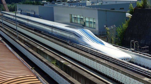 A maglev train passes along its track near an exhibition center in Yamanashi, Japan, about two hours from Tokyo. (Richard Colombo / Baltimore Sun)