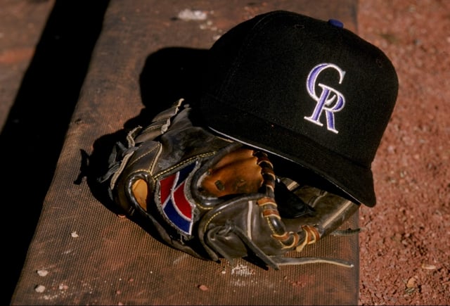 A general view of a glove and a Colorado Rockies cap during a spring training game between the Colorado Rockies and the San Francisco Giants at the Hi Corbett Field in Tucson, Arizona.