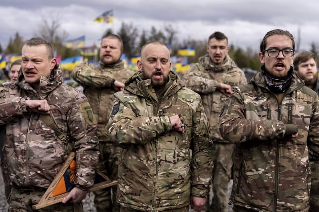 Ukrainian fighters pay their respect during a funeral ceremony in Krivyi Rih, Ukraine (Photo: Alex Babenko/AP)