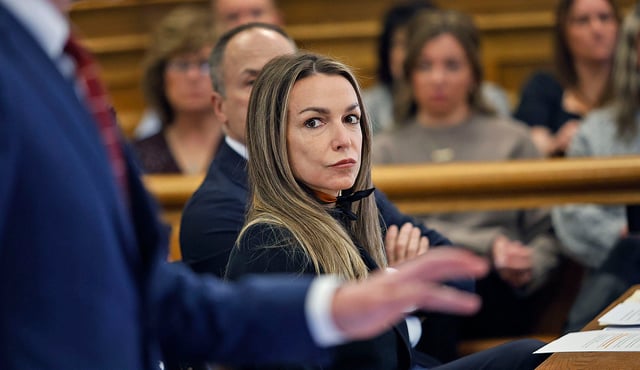 Karen Read watches attorney Robert Alessi speak while answering questions about the defense team’s relationship with crash reconstruction expert witnesses during a hearing in front of Judge Beverly Cannone in Norfolk Superior Court at Dedham, Massachusetts, on Tuesday, Feb. 25, 2025.