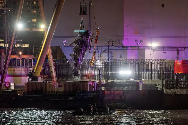 The wreckage of a helicopter that crashed into the Hudson River is extracted from the water in Jersey City, New Jersey, US, on Thursday, April 10, 2025. 