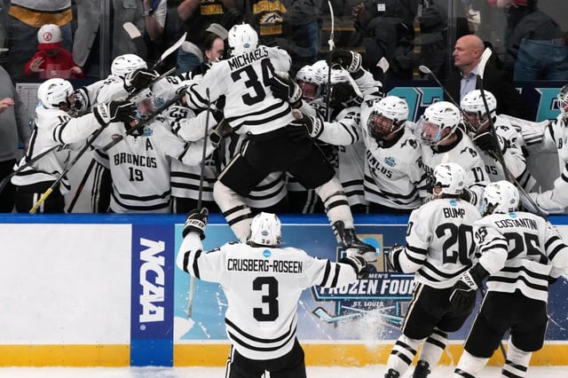Western Michigan’s Owen Michaels (34) is congratulated by teammates after scoring during the third period in the championship game of the Frozen Four against Boston University on April 12, 2025, in St. Louis (Jeff Roberson/AP)