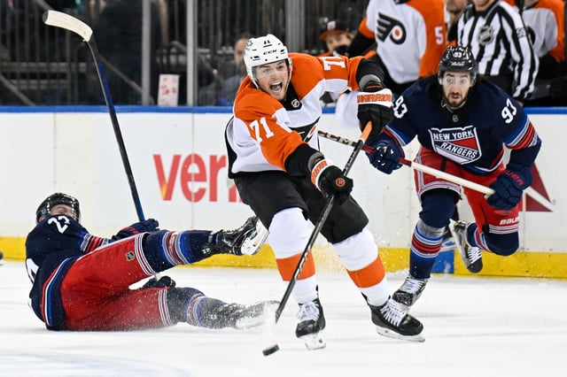 Apr 9, 2025; New York, New York, USA;  Philadelphia Flyers right wing Tyson Foerster (71) shoots and scores his fourth goal on an empty net against the New York Rangers during the third period at Madison Square Garden. Mandatory Credit: Dennis Schneidler-Imagn Images