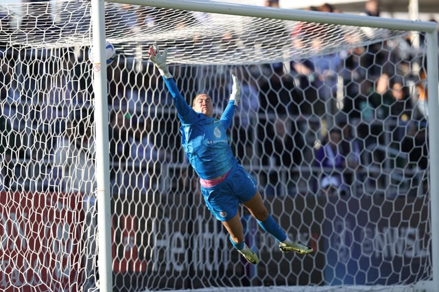 Apr 12, 2025; Louisville, Kentucky, USA;  Racing Louisville FC goalkeeper Katie Lund (1) misses a goal during the second half against Washington Spirit at Lynn Family Stadium. Mandatory Credit: EM Dash-Imagn Images