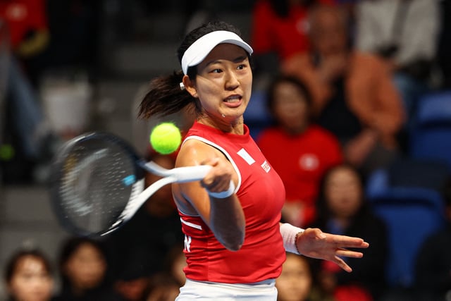 Tennis - Billie Jean King Cup Qualifiers - Group A - Canada v Japan - Ariake Colosseum, Tokyo, Japan - April 13, 2025 Japan's Moyuka Uchijima in action during her match against Canada's Marina Stakusic REUTERS/Kim Kyung-Hoon
