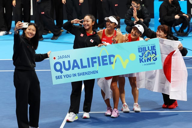 Tennis - Billie Jean King Cup Qualifiers - Group A - Canada v Japan - Ariake Colosseum, Tokyo, Japan - April 13, 2025 Japan's Ena Shibahara and Shuko Aoyama celebrate with captain Ai Sugiyama after winning their doubles match against Canada's Rebecca Marino and Kayla Cross REUTERS/Kim Kyung-Hoon
