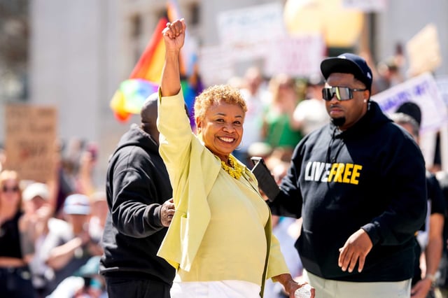 Mayoral candidate Barbara Lee raises her fist during the Oakland “Hands Off” protest against President Donald Trump and Tesla CEO Elon Musk on April 5.