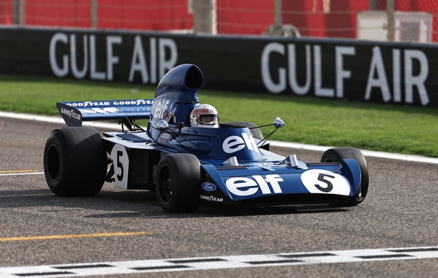 Formula One F1 - Bahrain Grand Prix - Bahrain International Circuit, Sakhir, Bahrain - April 13, 2025 Jackie Stewart driving his 1973 title-winning Tyrrell wearing a helmet to be auctioned off to raise funds for Sir Jackie Stewart's Race Against Dementia charity REUTERS/Hamad I Mohammed