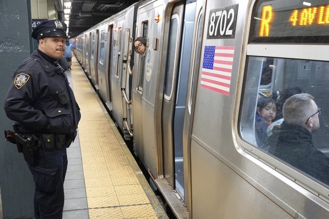 Police officers patrol in a subway station in New York, Thursday, March 20, 2025.