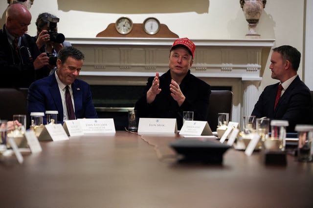 Tesla CEO Elon Musk wears a 'Trump Was Right About Everything!' hat, as he, U.S. Trade Representative Jamieson Greer and Central Intelligence Agency Director John Ratcliffe attend a cabinet meeting at the White House, in Washington, D.C., U.S., March 24, 2025. REUTERS/Carlos Barria/File Photo