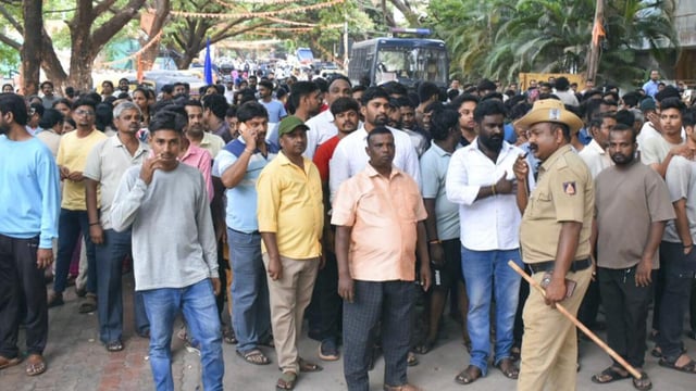 People protest amid protests over an alleged kidnapping and killing of a 5-year-old girl child at Hubballi, in Dharwad district, Karnataka, on Sunday. (PTI)