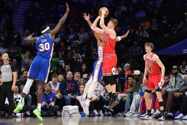Apr 13, 2025; Philadelphia, Pennsylvania, USA; Chicago Bulls guard Kevin Huerter (13) shoots the ball against Philadelphia 76ers center Adem Bona (30) in the first quarter at Wells Fargo Center. Mandatory Credit: Kyle Ross-Imagn Images