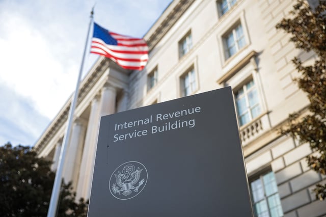 A sign for the Internal Revenue Service (IRS) is seen outside its building on February 13, 2025 in Washington, DC.