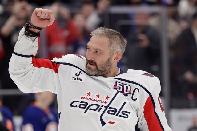 Washington Capitals left wing Alex Ovechkin (8) celebrates after scoring his 895th career goal during the second period of an NHL hockey game against New York Islanders in Elmont, N.Y., Sunday, April 6, 2025. (AP Photo/Adam Hunger)