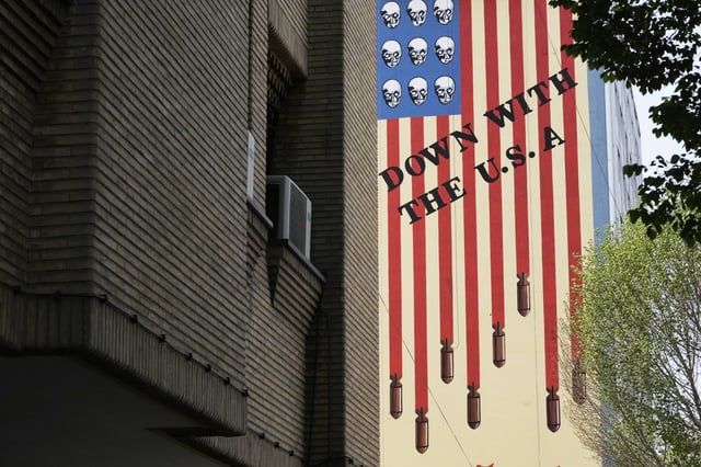 An anti-U.S. mural is seen in downtown Tehran, Iran, Sunday, April 13, 2025. (AP Photo/Vahid Salemi)