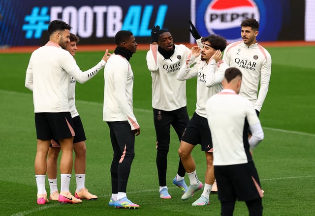 Soccer Football - Champions League - Paris St Germain Training - Villa Park, Birmingham, Britain - April 14, 2025 Paris St Germain's Ousmane Dembele and Vitinha during training Action Images via Reuters/Matthew Childs