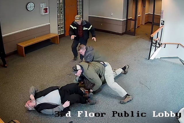 Arnuel Marquez Colmenarez, a 33 year old Venezuelan man, is tackled inside a New Hampshire courthouse by federal agents who knocked over a bystander during the arrest, in a still image from surveillance camera video taken in Nashua, New Hampshire, U.S. February 20, 2025.   New Hampshire Judicial Branch/Handout via REUTERS.