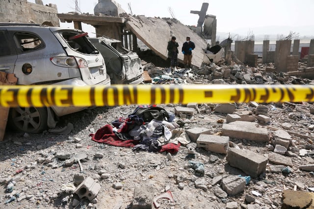 Forensic experts search the rubble of a house after it was hit by airstrikes directed by the U.S. on April 7, 2025, in Sana'a, Yemen.