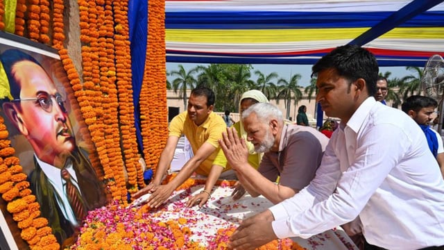 The atmosphere was charged with chants, drumbeats, and blue flags as people including local residents, political figures, social activists, students, and families, all came together to honour Ambedkar’s legacy. (Sunil Ghosh/HT Photo)