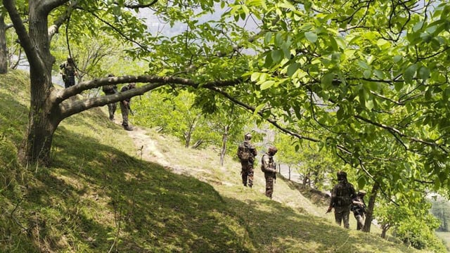 Security personnel keep vigil after a brief exchange of fire took place between terrorists and security forces in Lasana village of Surankote, in Jammu and Kashmir’s Poonch district on Tuesday. A soldier was injured in the gunfight. (PTI)