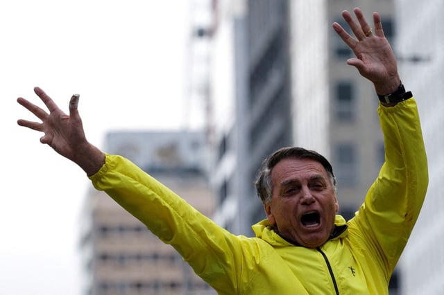 Former Brazilian President Jair Bolsonaro gestures during a demonstration against his judicial process and to demand the amnesty of all accused of taking part in the allegedly conspiring to overthrow the government, in Sao Paulo, Brazil, April 6, 2025. REUTERS/Amanda Perobelli/File Photo