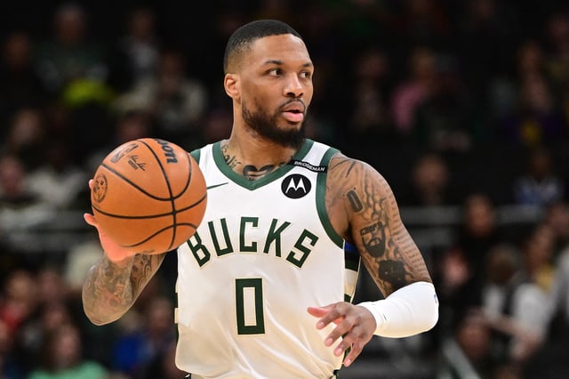 Mar 13, 2025; Milwaukee, Wisconsin, USA; Milwaukee Bucks guard Damian Lillard (0) dribbles the ball against the Los Angeles Lakers in the first quarter at Fiserv Forum. The Bucks wore a small patch to honor former player Junior Bridgeman who passed away this week.  Mandatory Credit: Benny Sieu-Imagn Images/ File Photo