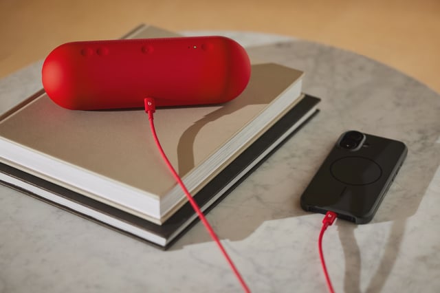 Here's a rapid red USB-C to USB-C cable running between a Pill speaker and a smartphone.