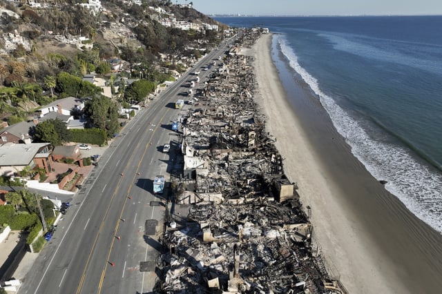 FILE - An aerial view shows the devastation from the Palisades Fire on beachfront homes, Jan. 15, 2025 in Malibu, Calif. (AP Photo/Jae C. Hong, File)