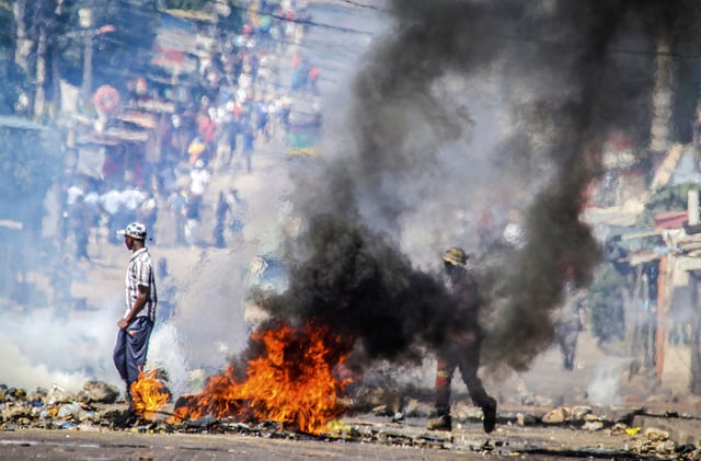 FILE- A barricade burns in Mozambique's capital, Maputo, Tuesday, Nov. 5, 2024. (AP Photo/Carlos Uqueio, file)