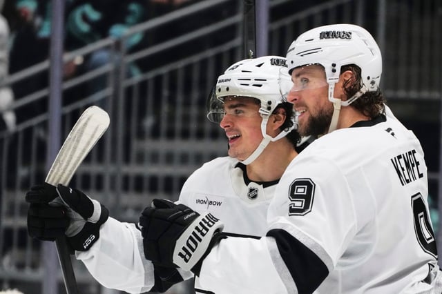 Kings right wing Adrian Kempe, right, celebrates his goal with center Alex Turcotte during the third period of their 6-5 victory over the Seattle Kraken on Tuesday night in Seattle. (AP Photo/Lindsey Wasson)