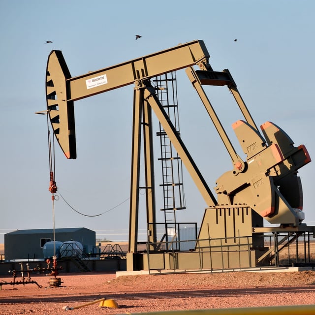 A pumpjack is seen extracting crude oil from a well near New Town, N.D. on the Fort Berthold Indian Reservation on Tuesday May 18, 2021. (AP Photo/Matthew Brown)