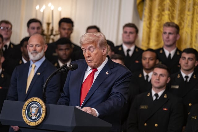 US President Donald Trump presents Commander-in-Chief Trophy to the Navy Midshipmen the United States Naval Academy football team in the East Room of the White House on April 15, 2025, in Washington, D.C., USA.