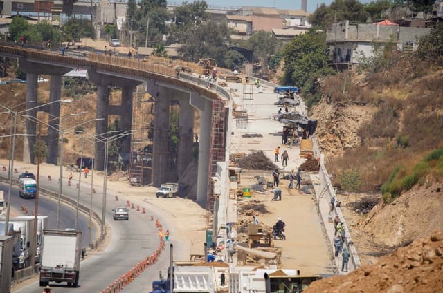The Otay Mesa East border crossing, also known as Otay II, will be used for both vehicle and commercial crossings between the U.S. and Mexico. Construction of several bridges along the highway for the Otay II project in Tijuana on July 3, 2024. (Alejandro Tamayo / The San Diego Union-Tribune)