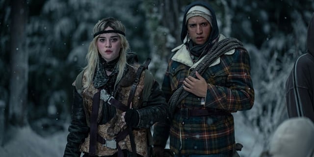 Sophie Thatcher as young Natalie and Kevin Alves as Travis in Yellowjackets Season 2 Episode 2