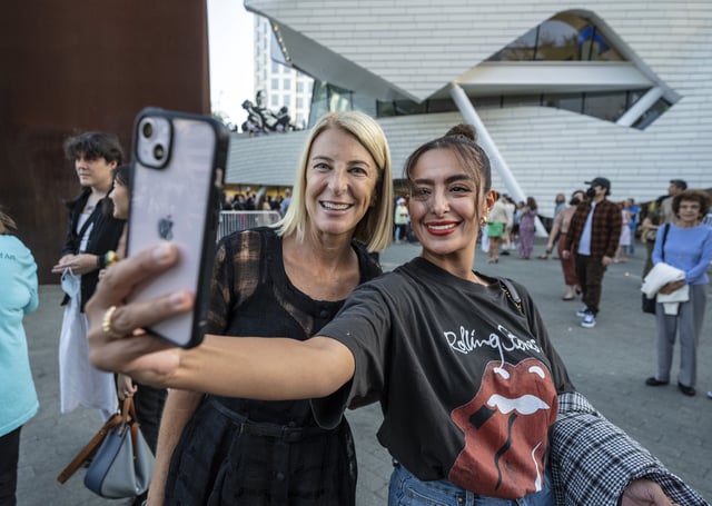 Costa Mesa, CA – October 08: Just after the doors were opened to the public, Orange County Museum of Art CEO and Director Heidi Zuckerman, left, poses for a selfie with Belen Lopez of Los Angeles late Saturday afternoon, October 8, 2022, in Costa Mesa. The museum opened to the public at 5 pm with a 24-hour grand opening celebration. (Photo by Mark Rightmire/MediaNews Group/Orange County Register via Getty Images)