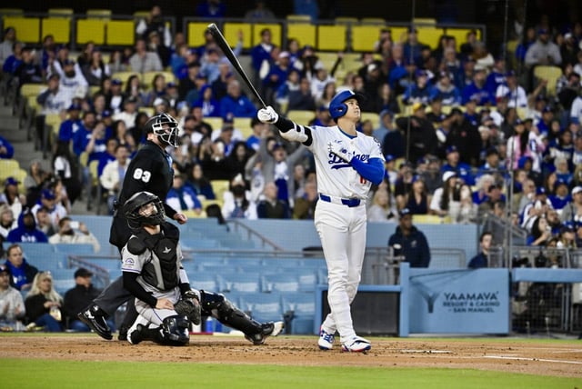 Dodgers star Shohei Ohtani watches the flight of his solo home run during the first inning of their game against the Colorado Rockies on Wednesday night, April 16, 2025, at Dodger Stadium. The Dodgers scored seven runs in the first inning, then held on for an 8-7 win. (Photo by Keith Birmingham, Orange County Register/SCNG)