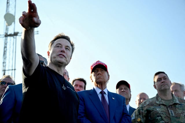 Elon Musk speaks with U.S. President-elect Donald Trump and guests at a viewing of the launch of the sixth test flight of the SpaceX Starship, in Brownsville, Texas, U.S., November 19, 2024 . Brandon Bell/Pool via REUTERS/File Photo
