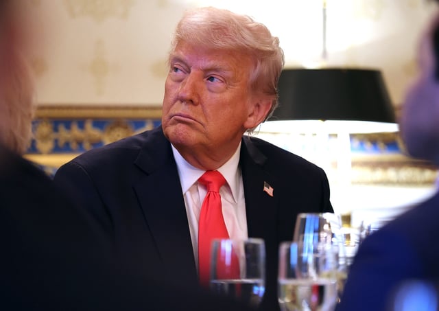 U.S. President Donald Trump looks on before he delivers remarks during an Easter Prayer Service and Dinner in the Blue Room of the White House on April 16, 2025 in Washington, DC.
