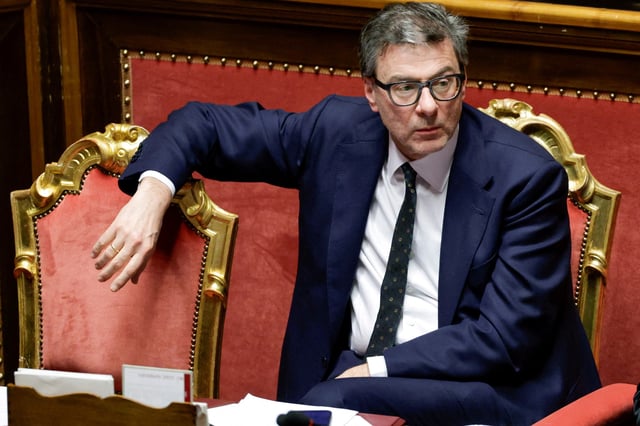 Italy's Economy Minister Giancarlo Giorgetti looks on, as Italy's Prime Minister Giorgia Meloni appears at the upper house of the Parliament in Rome, ahead of a European Union leaders' summit, in Rome, Italy, March 18, 2025. REUTERS/Remo Casilli/File Photo