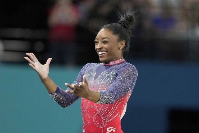 Simone Biles, of the United States, celebrates after completing her routine in the women&#39;s artistic gymnastics individual floor exercise finals at Bercy Arena at the 2024 Summer Olympics, Monday, Aug. 5, 2024, in Paris, France.