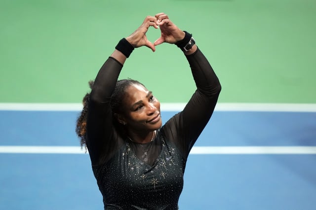 Serena Williams reacts to the crowd after falling to Ajla Tomljanovic of Australia at the 2022 U.S. Open, her final match before stepping away from the game.