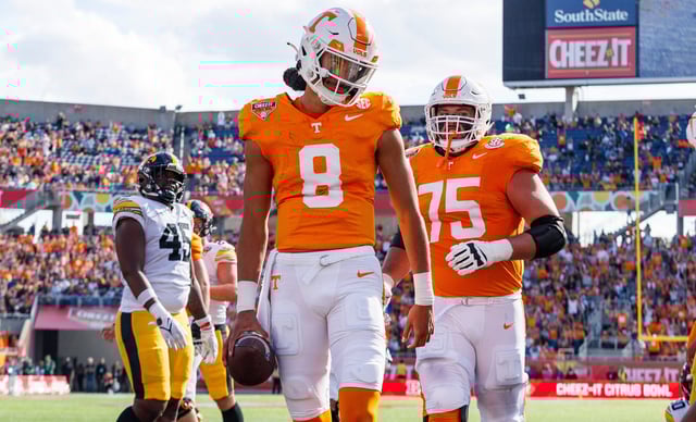 Tennessee quarterback Nico Iamaleava (8) scores a touchdown against Iowa during the 2024 Citrus Bowl at Camping World Stadium.